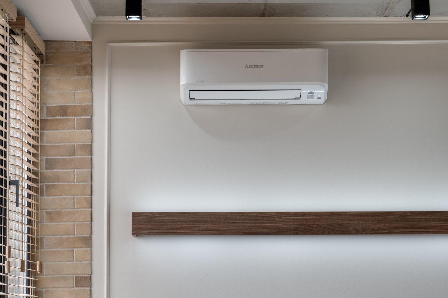Wall-mounted ductless mini-split indoor unit in a residential living room
